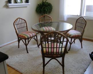 Rattan and glass dining room table, or kitchen table