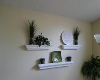Wall shelves filled with outstanding pieces of decorative arts
