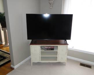 Large flat screen TV, with an amazing coastal vibe media furniture
