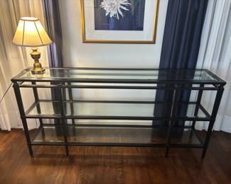 Black metal and glass sofa table. 68”w 14”d 32”t.   $ 250.00