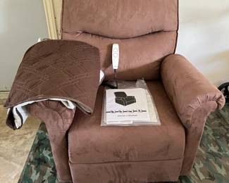 Lift chair--brand new--used 2 months--with waterproof cover and remote control--lies completely flat--made by Pride