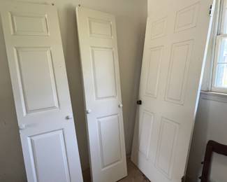 Two folding doors and one bedroom door
