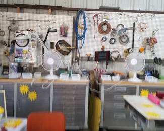 Two large tool benches full of tools