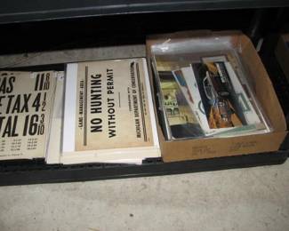 gas signs, hunting signs and vintage car dealer brochures