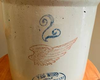 Red Wing 2-Gallon Stoneware Crock – Early 20th Century Americana
This charming 2-gallon Red Wing stoneware crock features the iconic red wing logo and cobalt number stamp, a hallmark of quality from the renowned Red Wing Stoneware Company (est. 1877). Crafted from durable, watertight stoneware and likely produced between 1906 and 1930, this crock served as essential kitchen storage before refrigeration. Ideal for collectors or rustic home décor, it’s a timeless piece of American heritage.