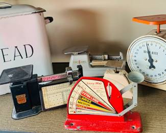 Vintage Kitchen Scales & Bread Bin
Charming collection of vintage kitchen scales in various styles and colors, including a red Jiffy-Way egg grader, a white Way Rite dial scale, and a rare Pinky Bowes model. A classic white “BREAD” bin completes this nostalgic kitchen set—perfect for collectors or vintage decor lovers.