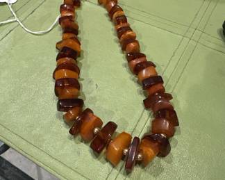 Butterscotch and cherry amber, 14 kt gold bead