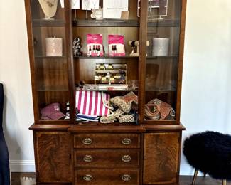 China cabinet with lighted interior, 3 drawers. Burlwood finish. Glass shelves. Door. $250