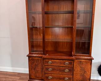 China cabinet with lighted inter. Burlwood finish. Glass shelves. 3 drawers. Door. $250