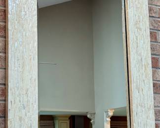 Large Mirror with a unique frame with a lacquered look.