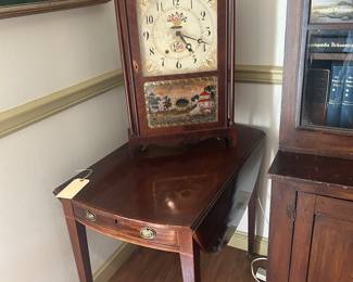 Mahogany drop leaf table with drawer, one damaged leg.