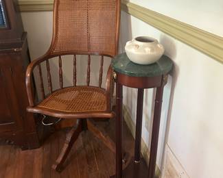 Antique reclining office chair with rattan back and seat (needs TLC), signed pottery by Juanito Sauzo DuBray with shell motif , Bombay & Company style pedestal stand.