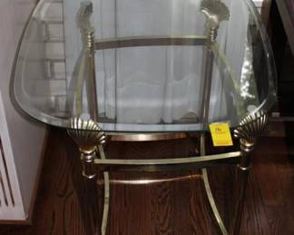 Glass top End Table w/ brass shell base 22" x 26" x 23"