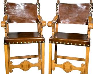 (2pc) PAIR OF BILLIARDS STOOLS | Carved wood & leather billiards stools with large riveted border, leather seat & back, and carved wood arms; seat height 26.5 in - h. 50.5 x w. 26 x d. 22 in