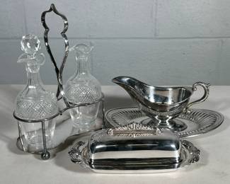 (2pc) SILVER PLATE ITEMS | Including: condiment set with silver plate holder & 2 cut crystal condiment holders, and silver plate butter dish with cut crystal insert - h. 10 x w. 3.5 x l. 7.5 in
