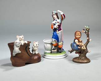 (3pc) Porcelain Pieces | Hummel of girl in tree, marked Germany. Large shoe with three kittens also marked on bottom and porcelain man with empty bowl possibly for matches. - h. 9 x w. 5 in (Tallest)