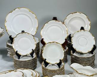 (95pc) Hutschenreuther Porcelain Germany Brighton Pattern Part Dinner & Coffee Set | 95 Pieces Total:
12 Coffee Cups 5’ Wide 2.75’ High.
12 Coffee Cup Saucers 6’ Wide
1 Sugar Bowl 4.75’ high 6’ Wide
1 Creamer 3’ High 5.75’ Wide
1 Gravy Boat 9’ Wide 3.75’ High
12 Bread Plates 6’ Wide ‘
12 Fruit Dessert Bowls 5’ Wide
1 Vegetable Tureen 11’ Wide 6’ High
2 Footed Vegetable Serving Bowls 10’ Wide 3’ High
12 Soup Bowls 8.25’ Wide. 12 Salad Bowls 7.5’ Wide - Hairline Crack to One. 12 Dinner Plates 10’ Wide. 4 Serving Platters 16’ 15’ 12’ - h. 1.25 x w. 10 x d. 6 in (small serving platter)