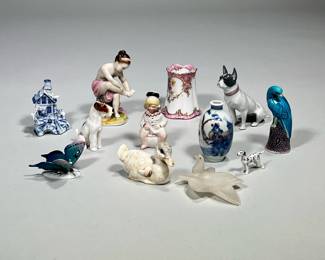 (12pc) Misc. Porcelain Items | Collection includes a duck, 3 dogs, butterfly, blue bird, 3 small vases, girl washing feet, child on pot and stone small dish with bird. 8 of the items are marked on the bottom.
Dimensions: h. 4 x w. 2 in (Girl washing feet)