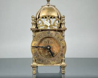 ENGLISH SMITHS 8 DAY LANTERN CLOCK | "Nell Gwynne" Lantern Clock c. 1950 in an engraved and openwork brass case. ACES are not clock experts, unless explicitly stated in the item listing we do not guarantee any clocks to be in working order, or to keep accurate time. - h. 7 x w. 3 x d. 3 in