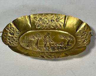 STAMPED BRASS PLATTER | Stamped brass decorative display platter depicting a hunting scene
- h. 1 x w. 6.5 x l. 10 in