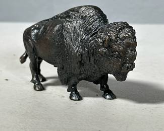 STEEL BUFFALO FIGURINE | Heavy cast steel buffalo figure - h. 2.5 x w. 1.5 x l. 4 in