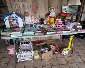 Table full of toys, games & dolls