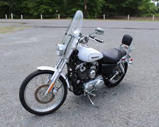 2007 Harley Davidson 1200 Motorcycle w/ Harley Davidson helmet & foot pegs, has a battery, currently has no key and no sure of mileage VIN# 1HD1CT3138K419055