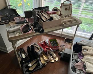 Prada, Jimmy Choo, Tod’s, Tory Burch, Gucci shoes & accessories. Cashmere sweaters, men’s Robert Graham $ Peter Millar, North Face.
