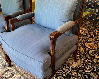 Pair of blue silk upholstered arm chairs – 29w x 34.5h x 23d. Some sun fading to back and top