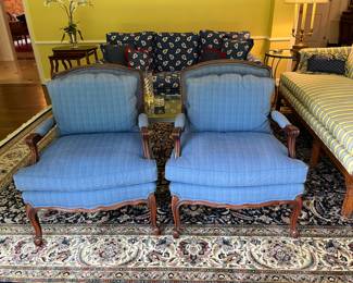 Pair of blue silk upholstered arm chairs – 29w x 34.5h x 23d. Some sun fading to back and top