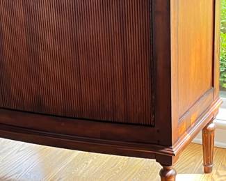 Granite top bow front sideboard with 2 interior drawers with silver storage. 2 reeded doors. 51w x 20.5d x 38h