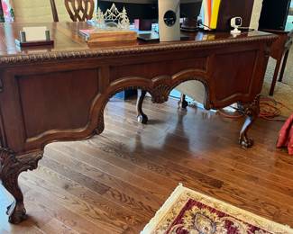 Large writing desk & chair, carved wood w/ claw and ball feet, 4 drawers, 62w x 32d x 30h.