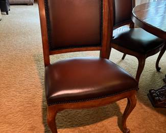 PRESALE Theodore Alexander side chairs, 6 available, faux leather with nailhead trim + Round table, 54” diameter, center pedestal with heavy carved feet.