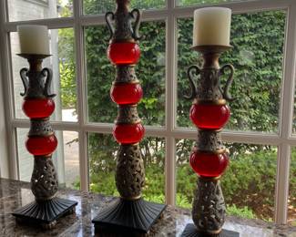 trio of decorative candlesticks