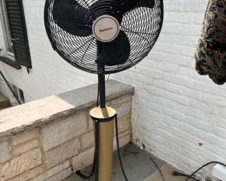 2 Holmes outdoor fans on 3 footed iron base