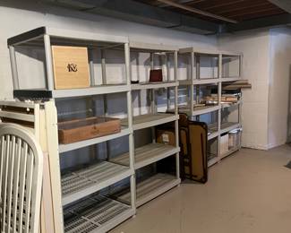 Plastic shelves and folding card table with chairs