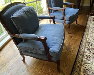 Pair of blue silk upholstered arm chairs – 29w x 34.5h x 23d. Some sun fading to back and top