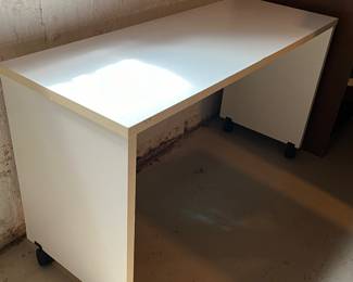 Slim laminate desk on wheels - great for dorm or college apartments
