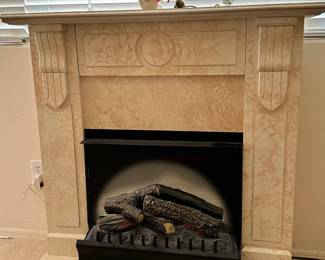 Faux fireplace with logs