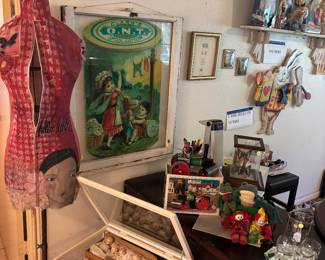 Standing form and curio with dolls