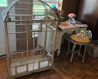 Decorative birdcage and vintage dresser