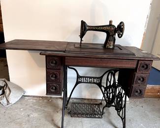 Antique Singer Treadle Sewing Machine with Ornate Wood Cabinet