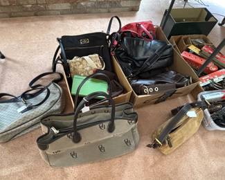 Variety of Coach, Kate Spade, Dooney Bourke, and more purses.