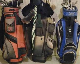 Three Golf Bags with Clubs