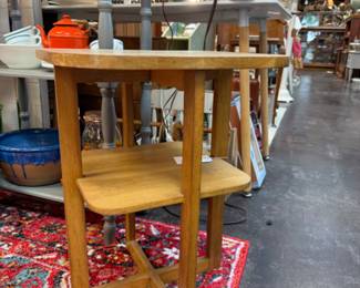 Vintage side table, beautiful rug, pottery drip bowl.