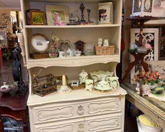 French provincial hutch with decor.