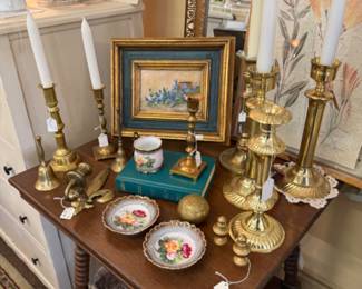 Beautiful vintage candlesticks add so much warmth and style to any space, as do small and large art work.