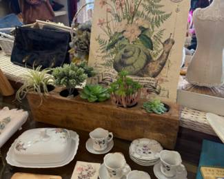 Wooden votive holder, tea cups & saucers, prints and clothing.