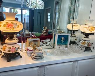 Teacups and saucers and lamps