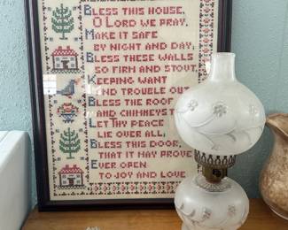 Gorgeous framed vintage cross stitch and another antique lamp